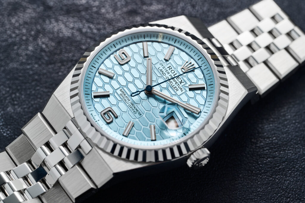 “Close-up of Rolex Land-Dweller Super Clone dial featuring fine laser-engraved texture and bright Super-LumiNova glow in low light.”