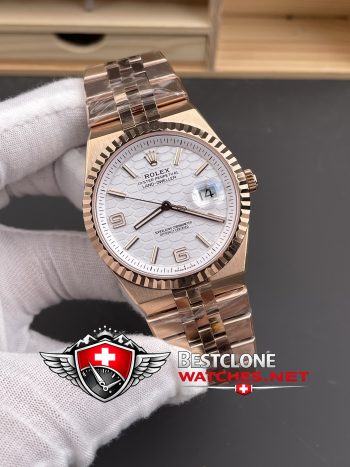 ES Rolex Land Dweller Rose Gold Dial Close Up (Honeycomb Texture)